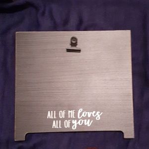 Black wooden picture frame with metal clip